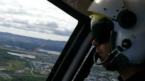 Helicopter pilot flying, 4k Stock Footage 69014347