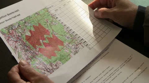 Helicopter pilot looking at map, close-up Stock Footage 54107252