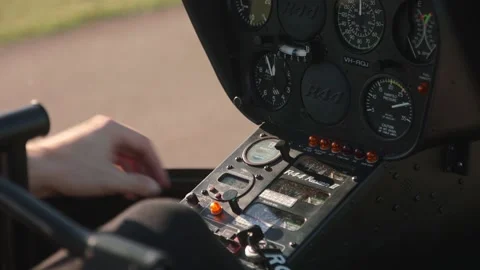 A helicopter pilot using his gauges while pressing and turning knobs and 動画素材 170938348