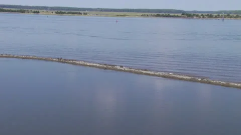 Helicopter POV of Breakwater Video stock 24309680