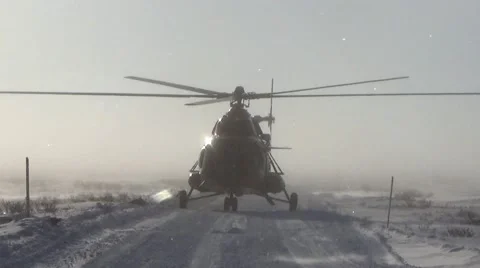 The helicopter prepares for takeoff in the winter Stock Footage 68403842