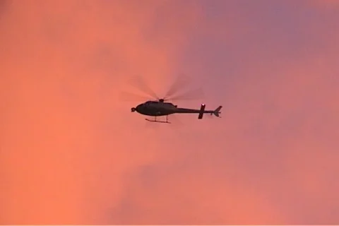 Helicopter on red sky Stock-Footage 95872