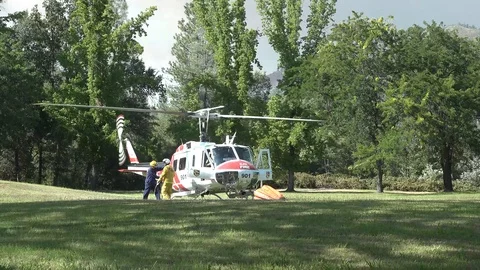 Helicopter refueling in the field Stock Footage 92809149
