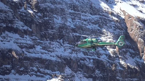 Helicopter in Rocky Mountains Stock Footage