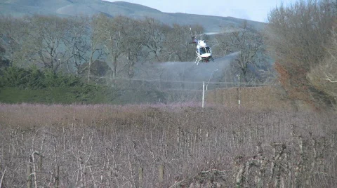 Helicopter row spray close  Stock Footage 838484