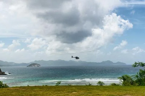 Helicopter on a scenic flight at seychelles beach Stock Photos