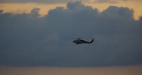 Helicopter seen in beautiful light during sunset in Los Angeles, California Stock Footage 115079626