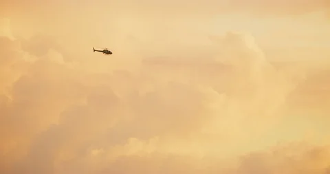 Helicopter seen in beautiful light during sunset in Los Angeles, California Stock Footage 116028083