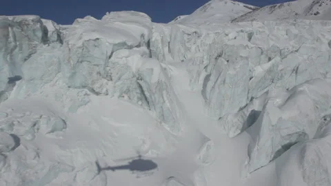 Helicopter Shadow on Blue Glacier Stock Footage 165624287