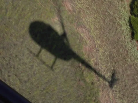 Helicopter Shadow Over Land POV Video stock 24586567