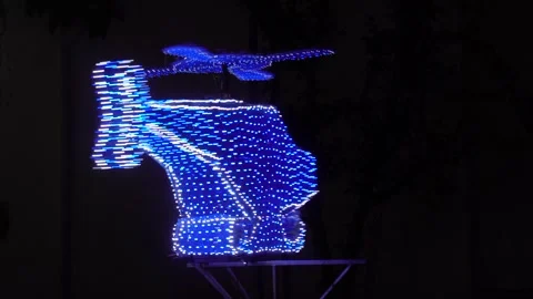 Helicopter shape created by a drone light show Stock-Footage 328522090