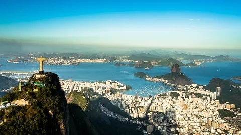 Helicopter shot of Christ the Redeemer with sugar loaf and guanabara bay 4k raw Stock Footage