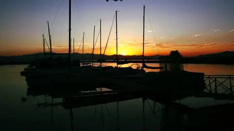 Helicopter shot over a dock at sunset Stock Footage 12013549