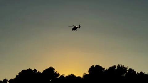 Helicopter Silhouette at Sunset Stock Footage 280053338