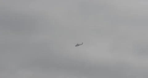 Helicopter in the sky, helicopter flying, clouds, blue sky Stock Footage 303407545