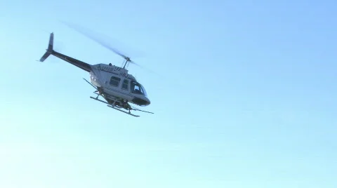 Helicopter spraying orchard  Stock Footage 836980