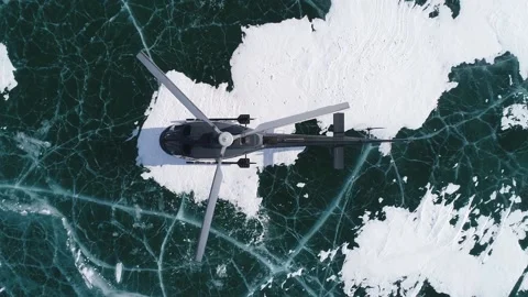The helicopter stands on the ice of the largest lake Baikal. Stock Footage 168478565