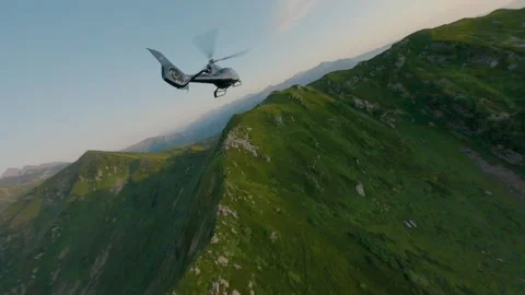 Helicopter at sunset mountain valley ridge aerial follow view Stock Footage 330077758