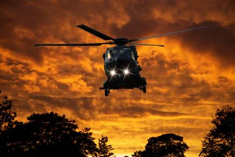 Helicopter at sunset Stock Photos