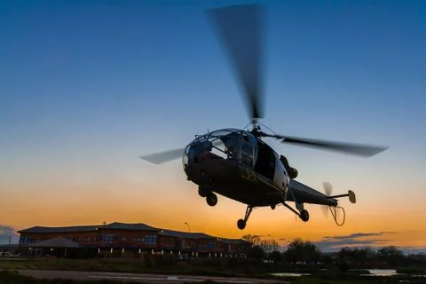 Helicopter at sunset Stock Photos