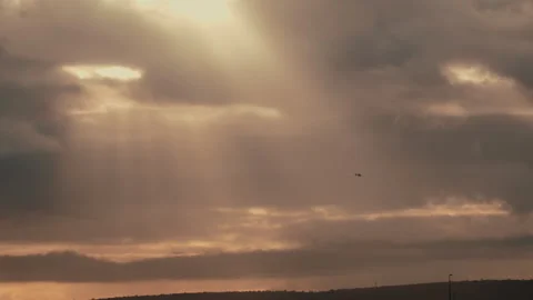 Helicopter in the sunset sky Stock Footage 311011504