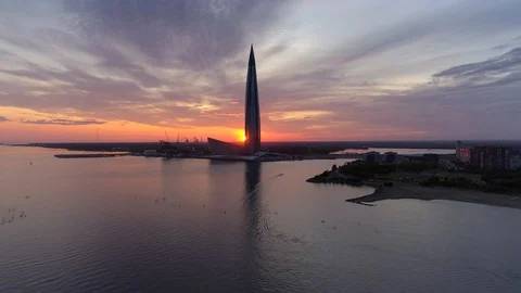 Helicopter sunset sun epic skyscraper business center complex Petersburg skyline Stock Footage 128621069