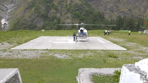 Helicopter take off from ghangaria Stock Footage 196554561