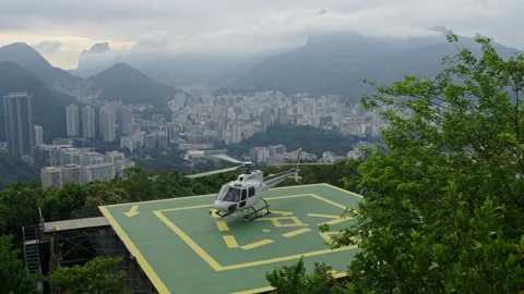 Helicopter take off from Sugarloaf, Rio de Janeiro, Brazil against cityscape Stock Footage 334816201