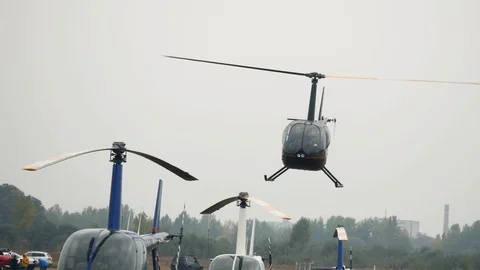 Helicopter takes off and flies over the airfield. Aviation festival holiday  Stock Footage 126124553