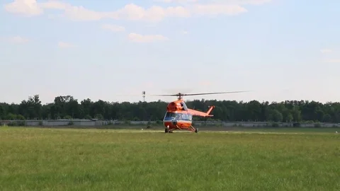 The helicopter takes off to the field. Stock Footage 81528852
