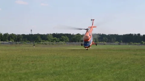 The helicopter takes off on the front wheel through the field. Stock Footage 82798950
