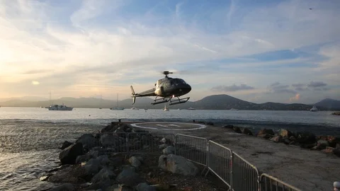 Helicopter takes off on the seashore Stock Footage 125521429