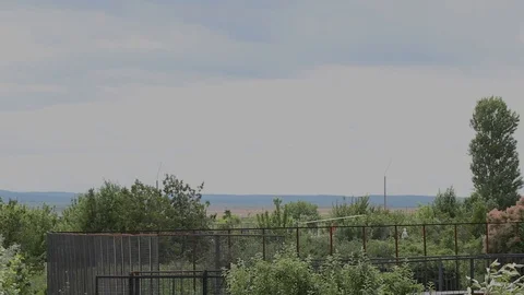 Helicopter takes off from the thicket of trees Stock Footage 86565408