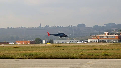 Helicopter taking off from airport Stock Footage 81372846