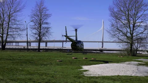 A helicopter taking off close to a bridge Stock Footage 242328779