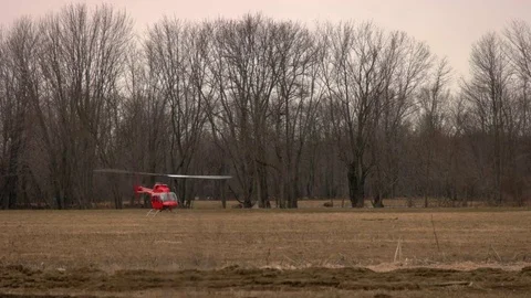 Helicopter Taking Off in a Farm Field. Stock Footage 74926546