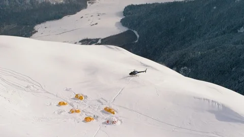 Helicopter taking off from mountain camp Stock Footage 113254402