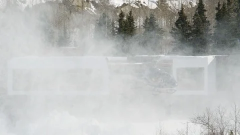 Helicopter taking off from a snowy mountain side Stock Footage 113260230
