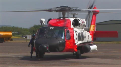 Helicopter on tarmac with pilot Stock Footage 61894465
