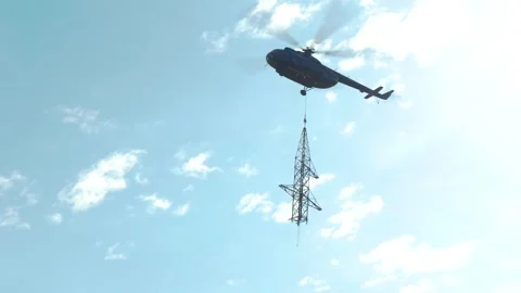 Helicopter Transporting Electricity Pylon Section Stock Footage 341968059