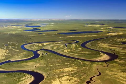 Helicopter view of the spring northern plain tundra with rivers and lakes. Stock Photos
