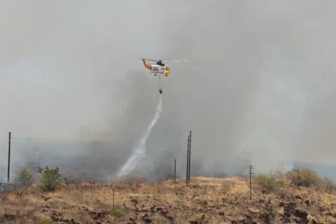 Helicopter Waterdrop on Wildfire Stock Photos
