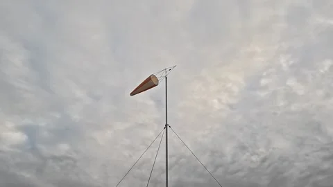 Helicopter Windsock Weather Vane Under Cloudy Sky Stock Footage 322054497