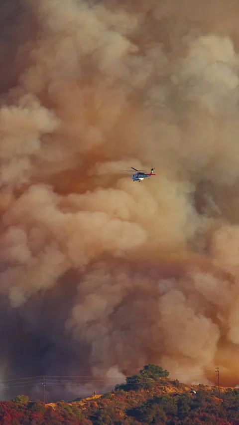 Helicopters Actively Battling Forest Fire in Malibu, Los Angeles Area Stock Footage 299676328