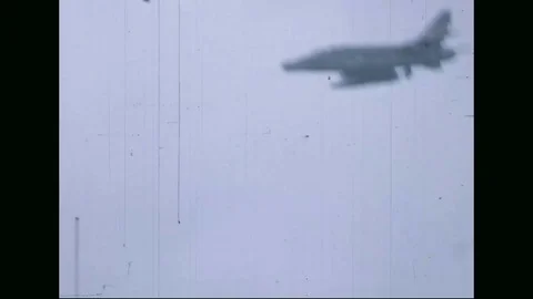 Helicopters and jets attack enemy positions - 1969 Stock Footage 96143412