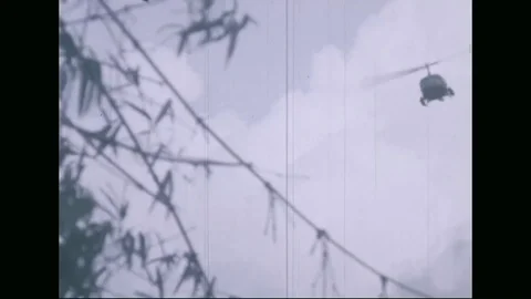 Helicopters attack enemy positions - 1969 Stock Footage 96143405
