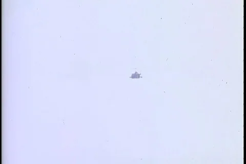 Helicopters attack enemy positions with min-guns and rockets - 1968 Stock Footage 106059981