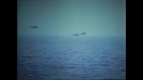 Helicopters flying over the ocean Stock Footage