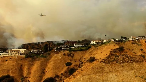 Helicopters flying through devastating neighborhood wildfire Stock-Footage 95768232