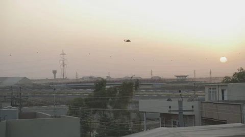 Helicoptor flying at sunset in Iraq Stock Footage 87792231